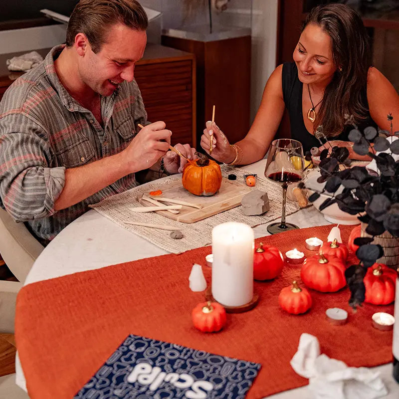 Halloween-themed Sculpd pottery kit painting pumpkin