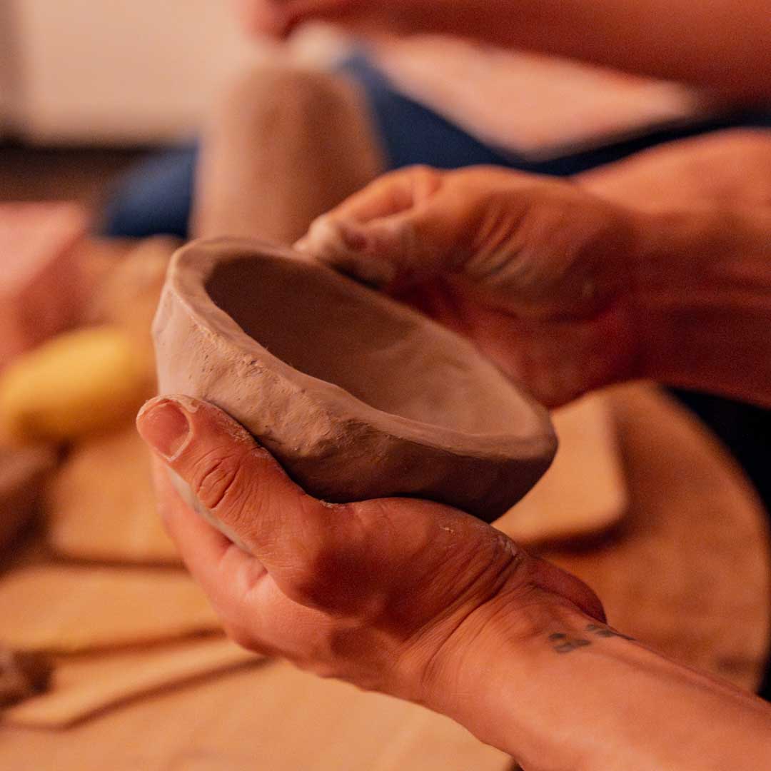 Sculpd Air-Dry clay being hand-shaped into a Pinch Pot bowl