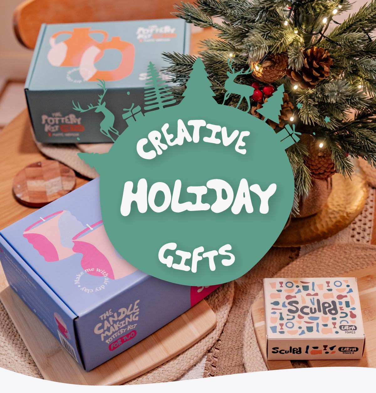 Sculpd Pottery Kit for Two and Sculpd Candle Making Kit for Two with Earth Tones Paints laid out on a holiday-themed table, image is overlaid with the words Creative Holiday Gifts