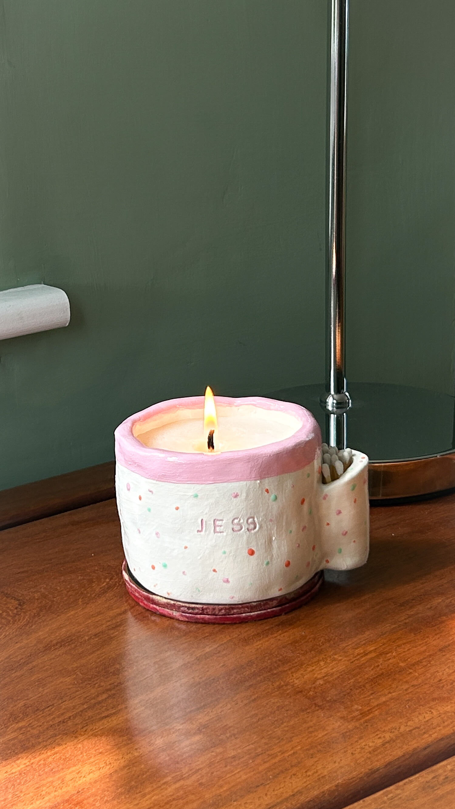 Scented candle in handmade ceramic mug